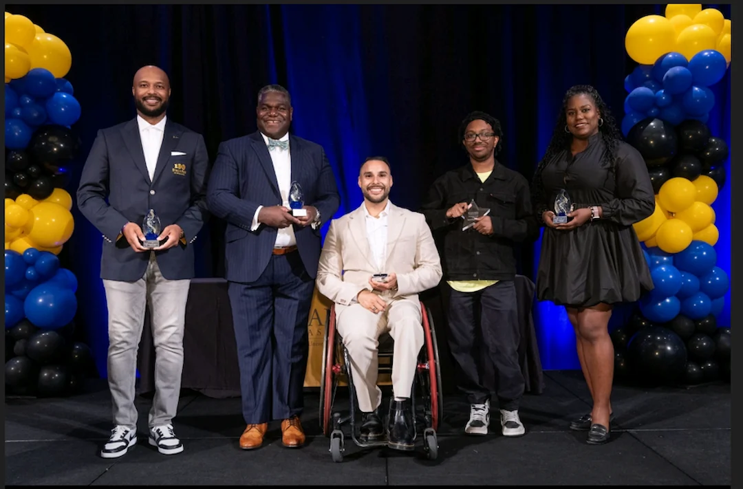 2025 Alumni Achievement Award honorees on stage